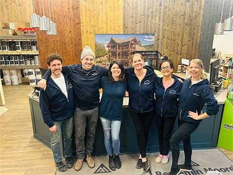 Company staff posing for a photo in the showroom