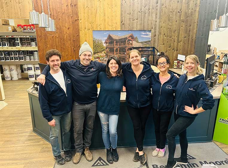 Company staff posing for a photo in the showroom