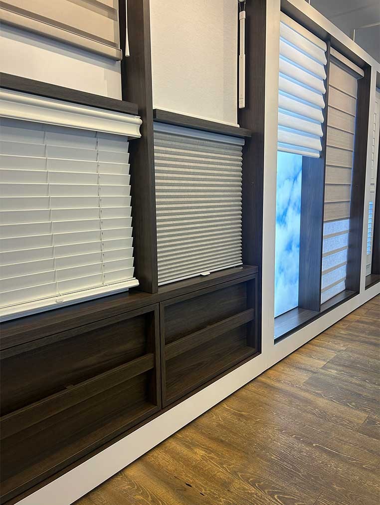 Store interior showcasing several different types of window coverings